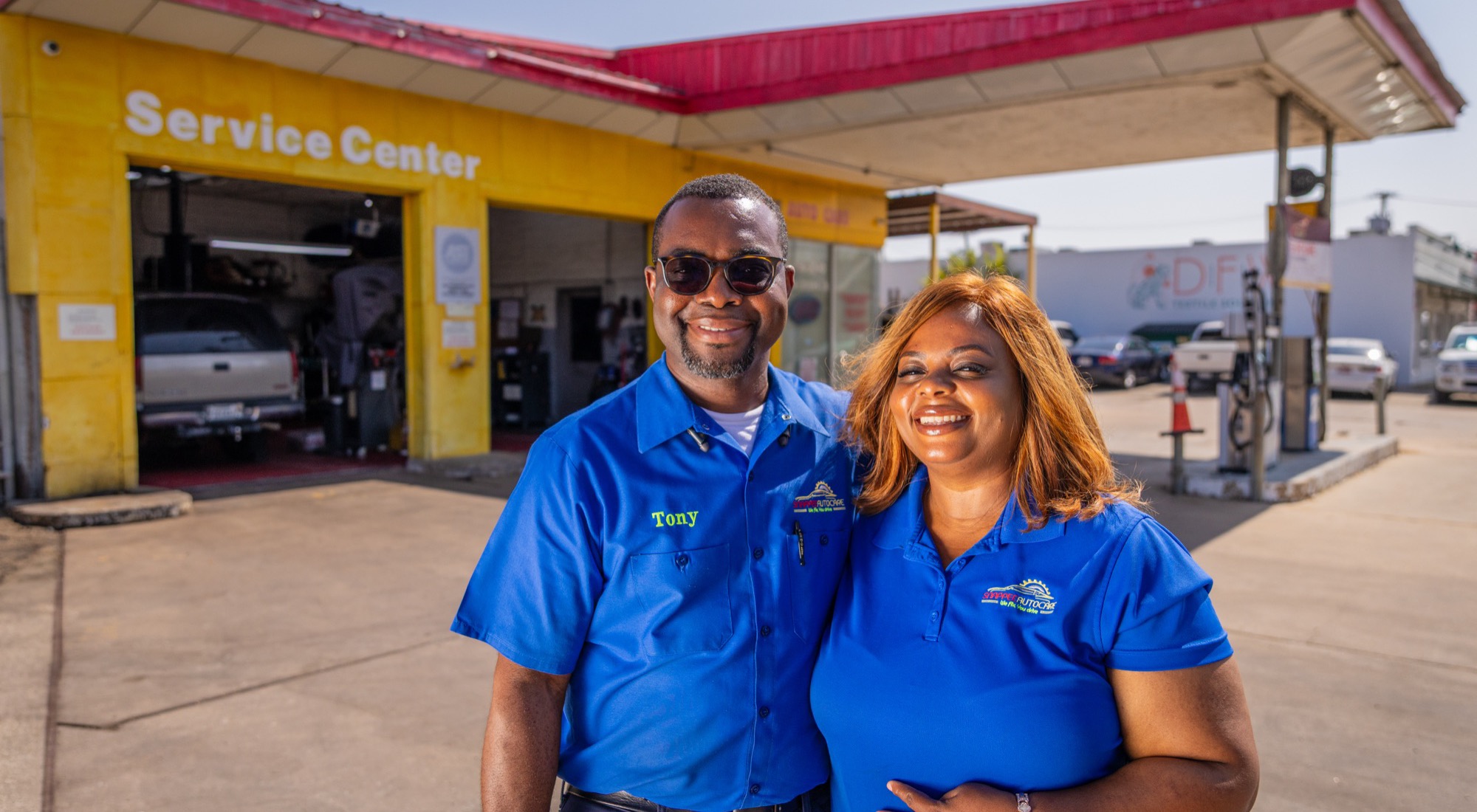 Tony and Tina, owners of Snappee Auto Care, outside the Dallas shop